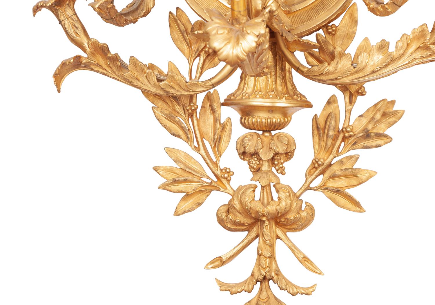 A Set of Four Louis XVI Style Gilt Bronze Five-Light Scones