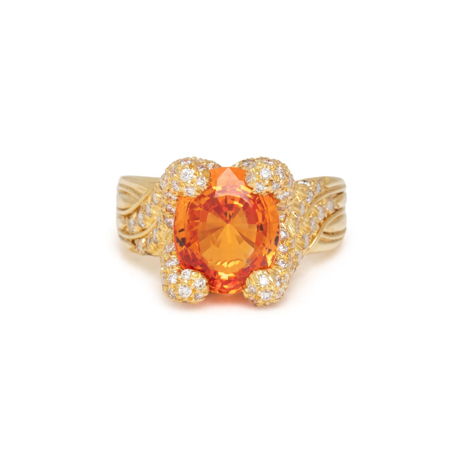 HENRY DUNAY, YELLOWISH ORANGE SAPPHIRE AND DIAMOND RING