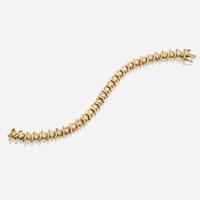 A gold and diamond bracelet