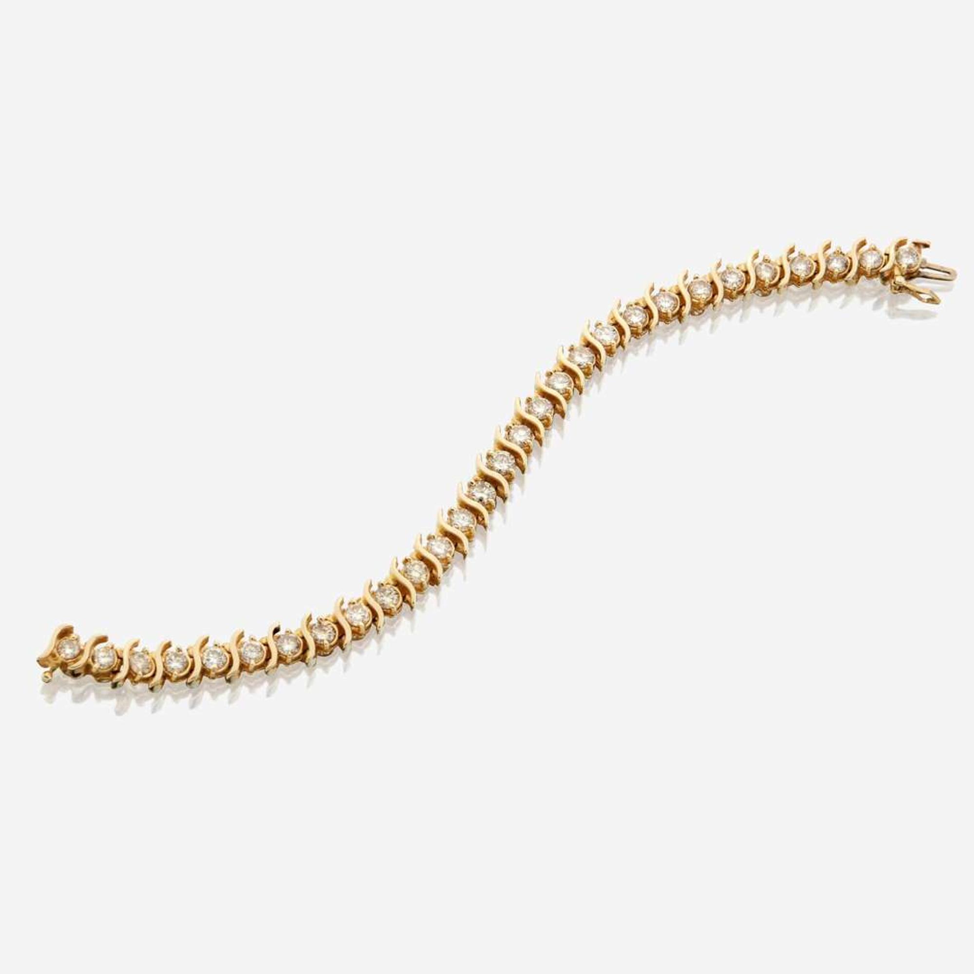 A gold and diamond bracelet