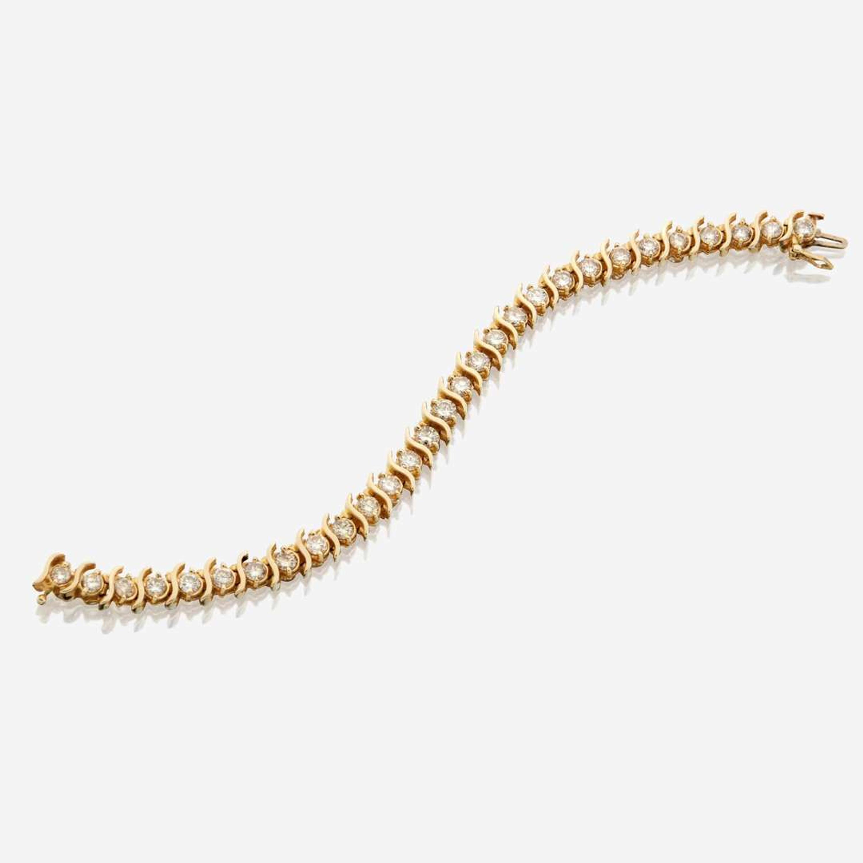 A gold and diamond bracelet