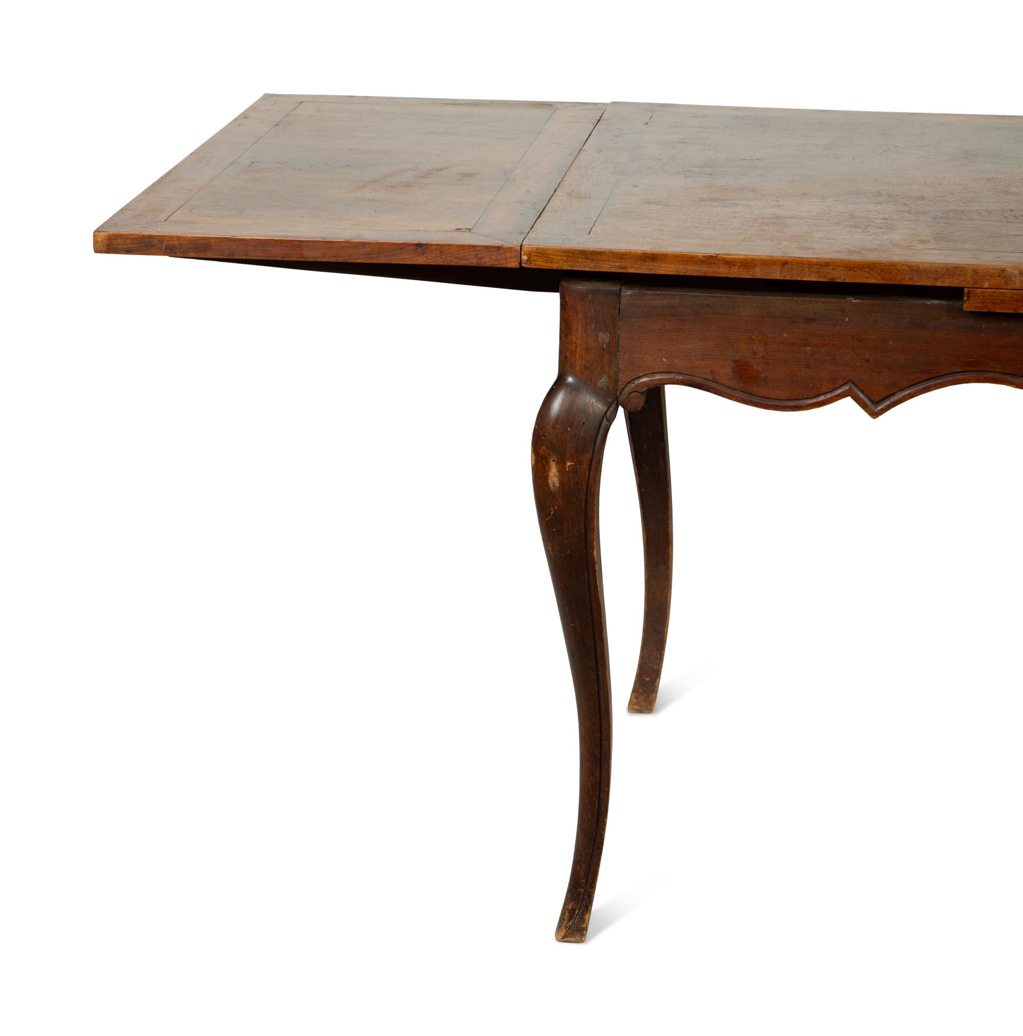 A French Walnut Draw-Leaf Dining Table