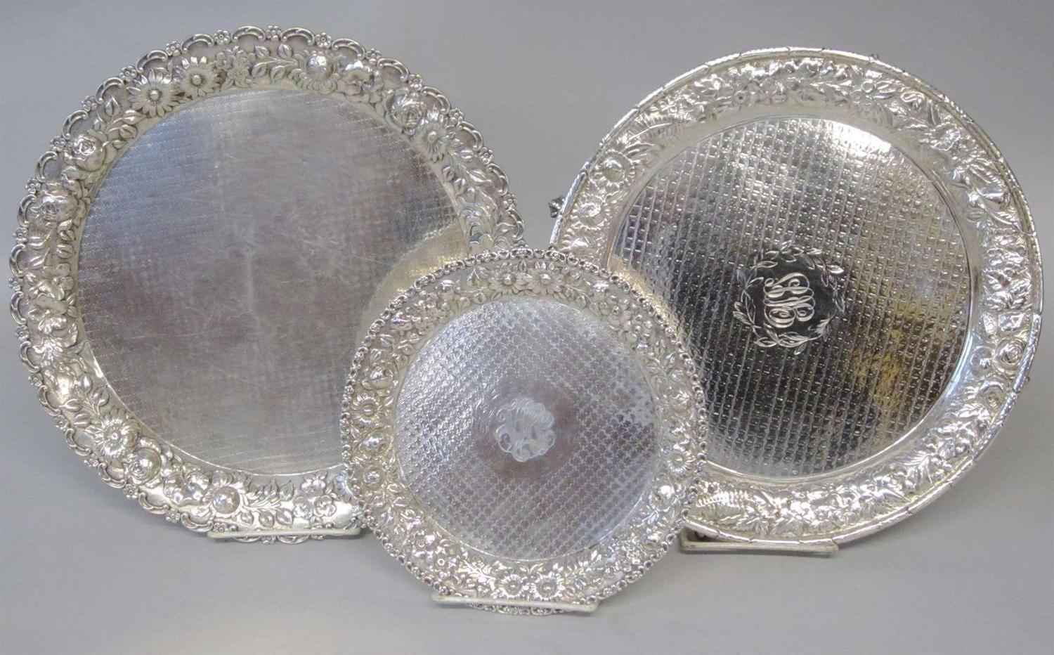 Three sterling silver repoussé trays various makers, 20th century