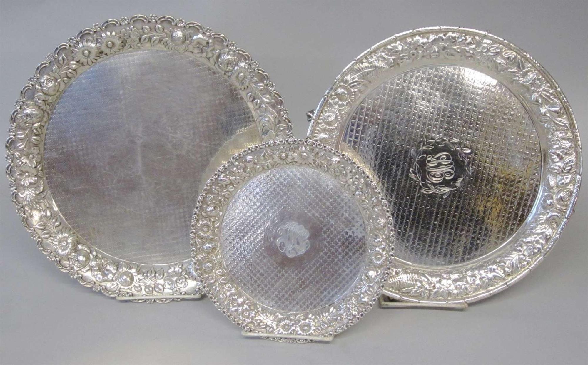 Three sterling silver repoussé trays various makers, 20th century