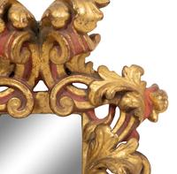 An Italian Rococo Style Red and Parcel Gilt Carved Wood Mirror