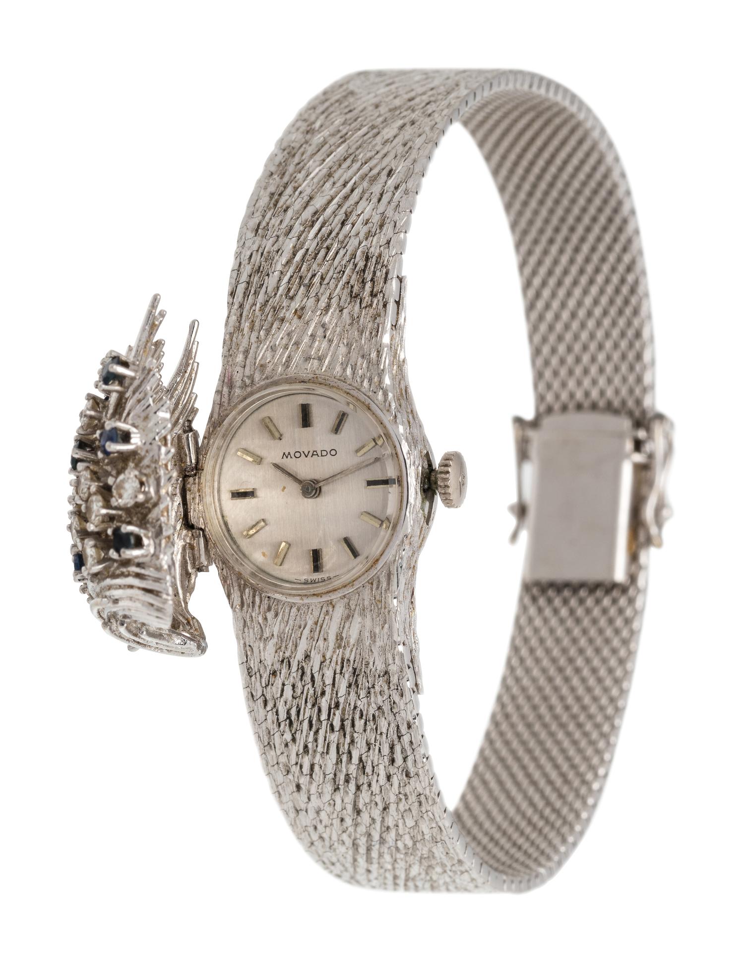 MOVADO, 18K WHITE GOLD, DIAMOND AND SAPPHIRE SURPRISE WRISTWATCH