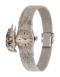 MOVADO, 18K WHITE GOLD, DIAMOND AND SAPPHIRE SURPRISE WRISTWATCH