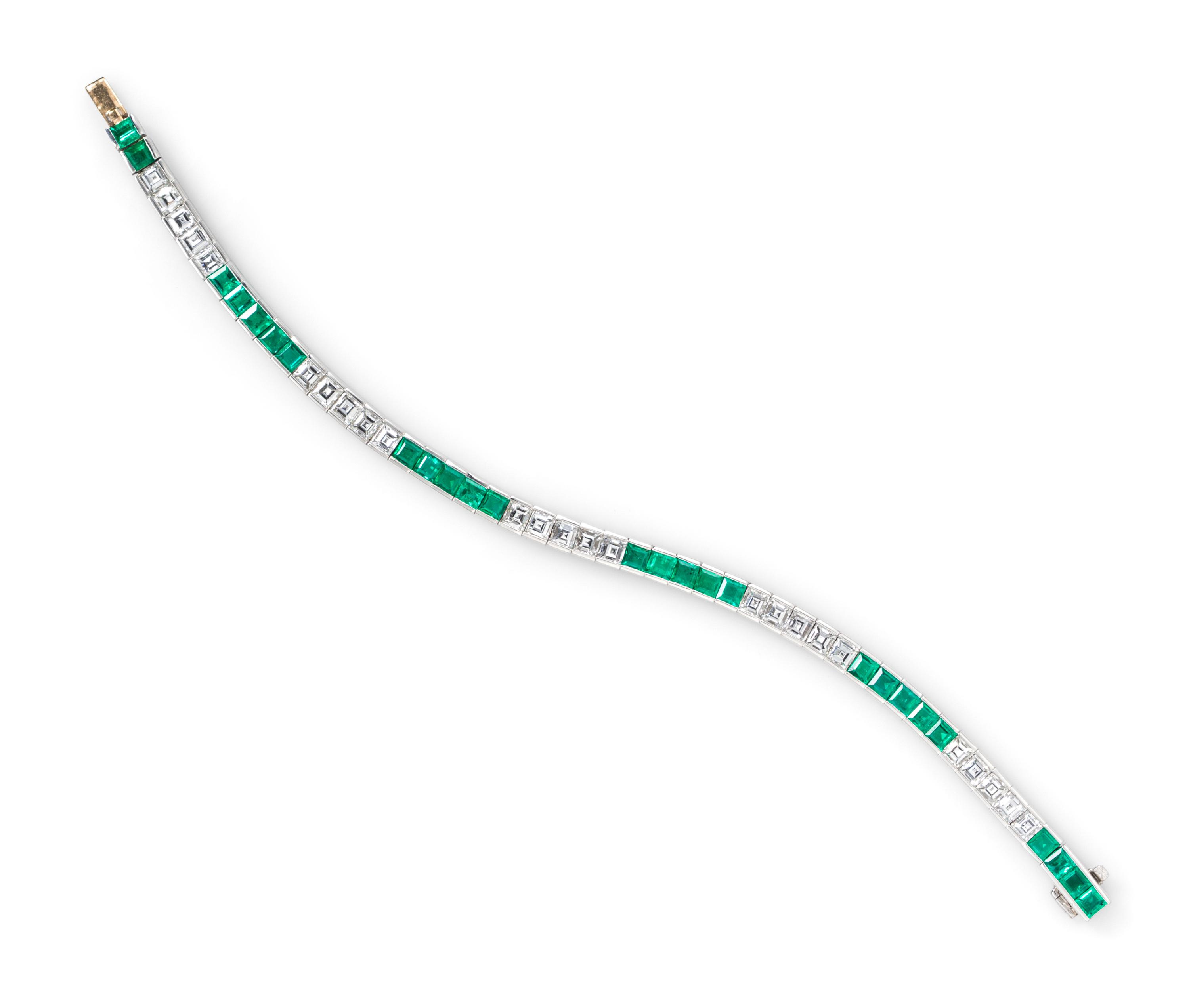 A Platinum, Diamond and Emerald Line Bracelet, 19.50 dwts.