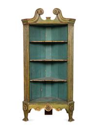 A George III Green-Painted and Parcel Gilt Corner Bookcase