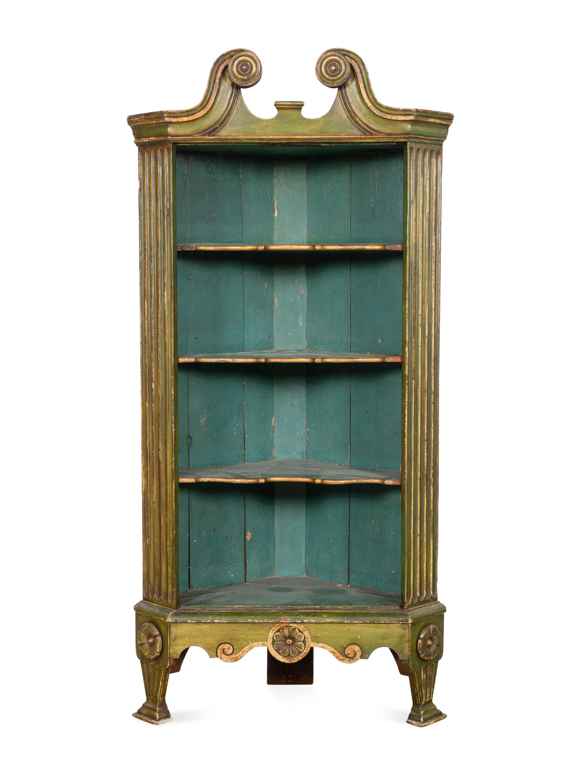 A George III Green-Painted and Parcel Gilt Corner Bookcase