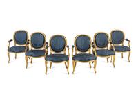 A Set of Six George III Carved Giltwood Armchairs