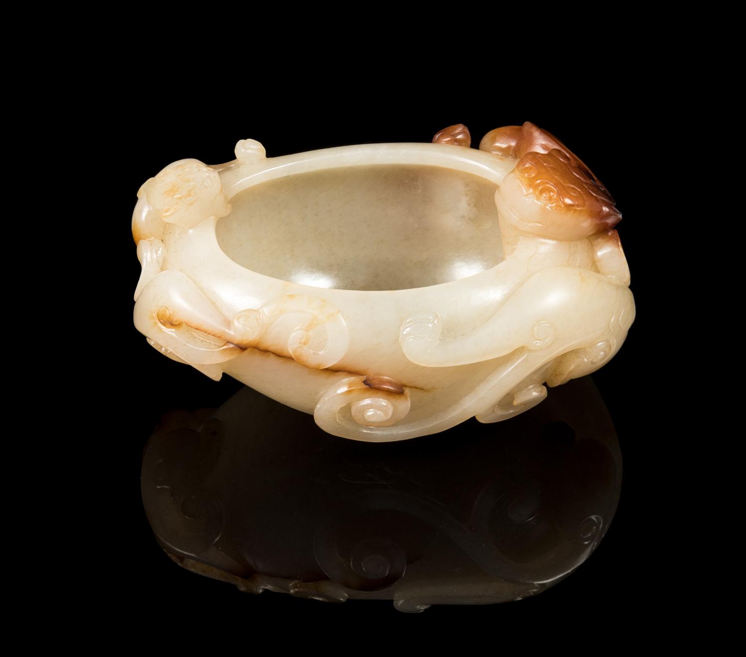 A White and Russet Jade Chilong Water Coupe Length 3 1/8 inches. — 19TH CENTURY