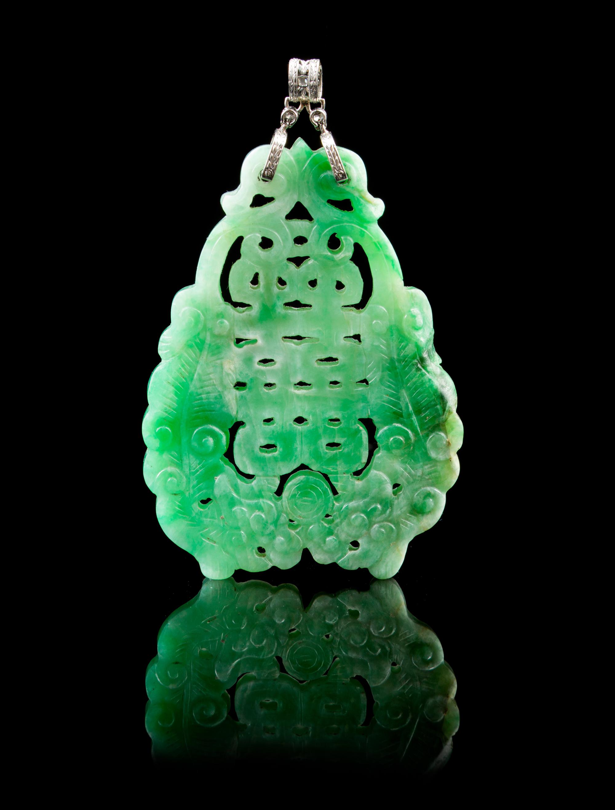 A Chinese Pierce Carved Jadeite, Platinum and Diamond Plaque Height 2 1/2 inches.