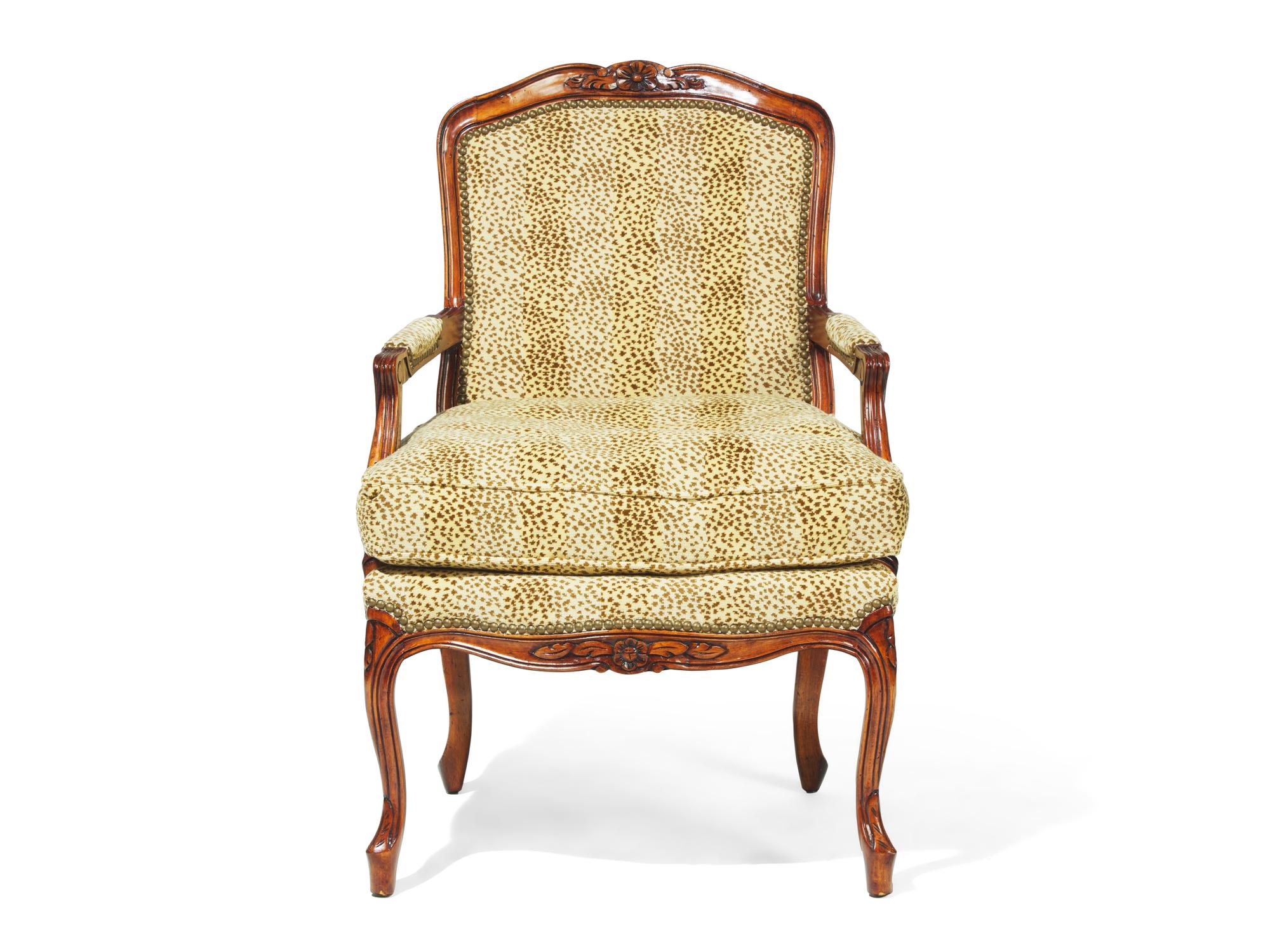 A Louis XV Style Carved Fruitwood Fauteuil