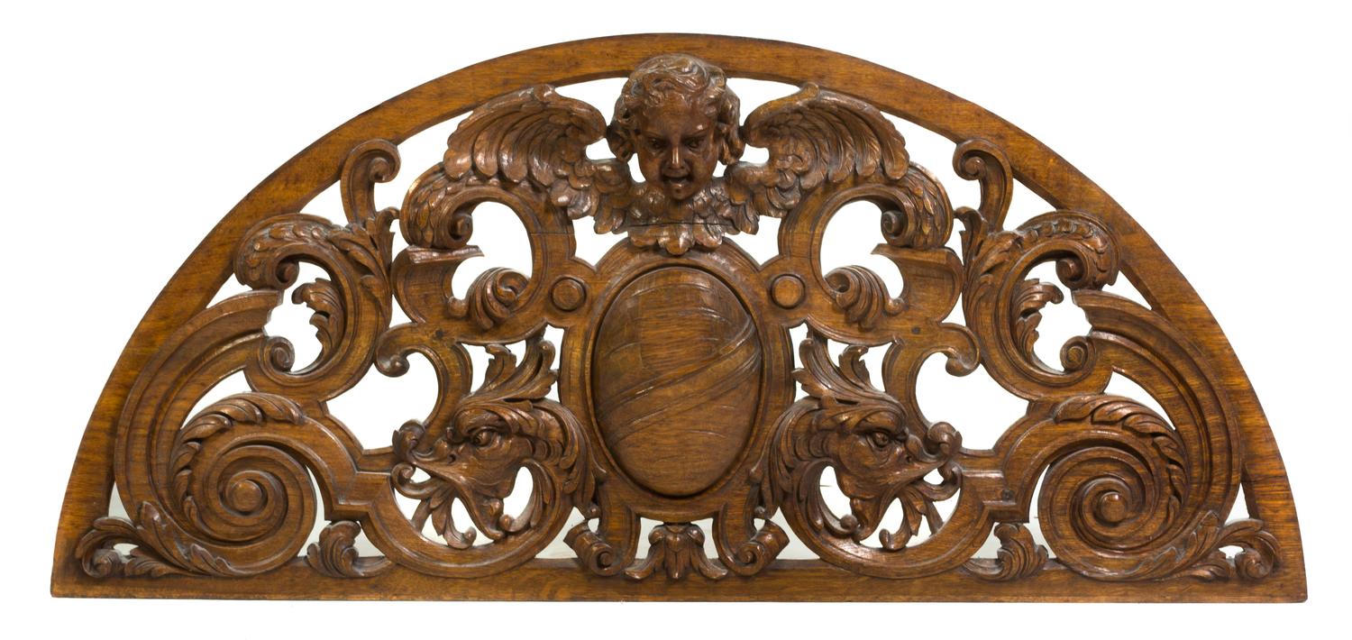 A Renaissance Revival Carved Over Door Panel, Height 20 1/2 x width 48 inches.