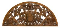 A Renaissance Revival Carved Over Door Panel, Height 20 1/2 x width 48 inches.