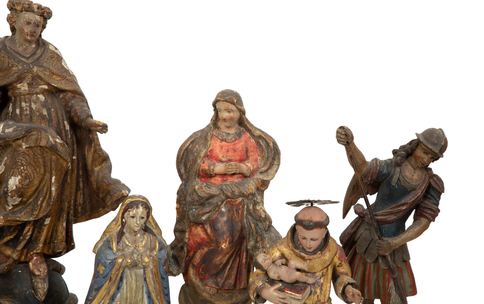 A Group of Eight Carved and Polychromed Santos Figures