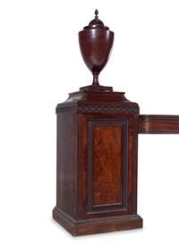 An Edwardian Carved and Figured Mahogany Double Pedestal Sideboard and a Pair of Urn-Form Cutlery Boxes