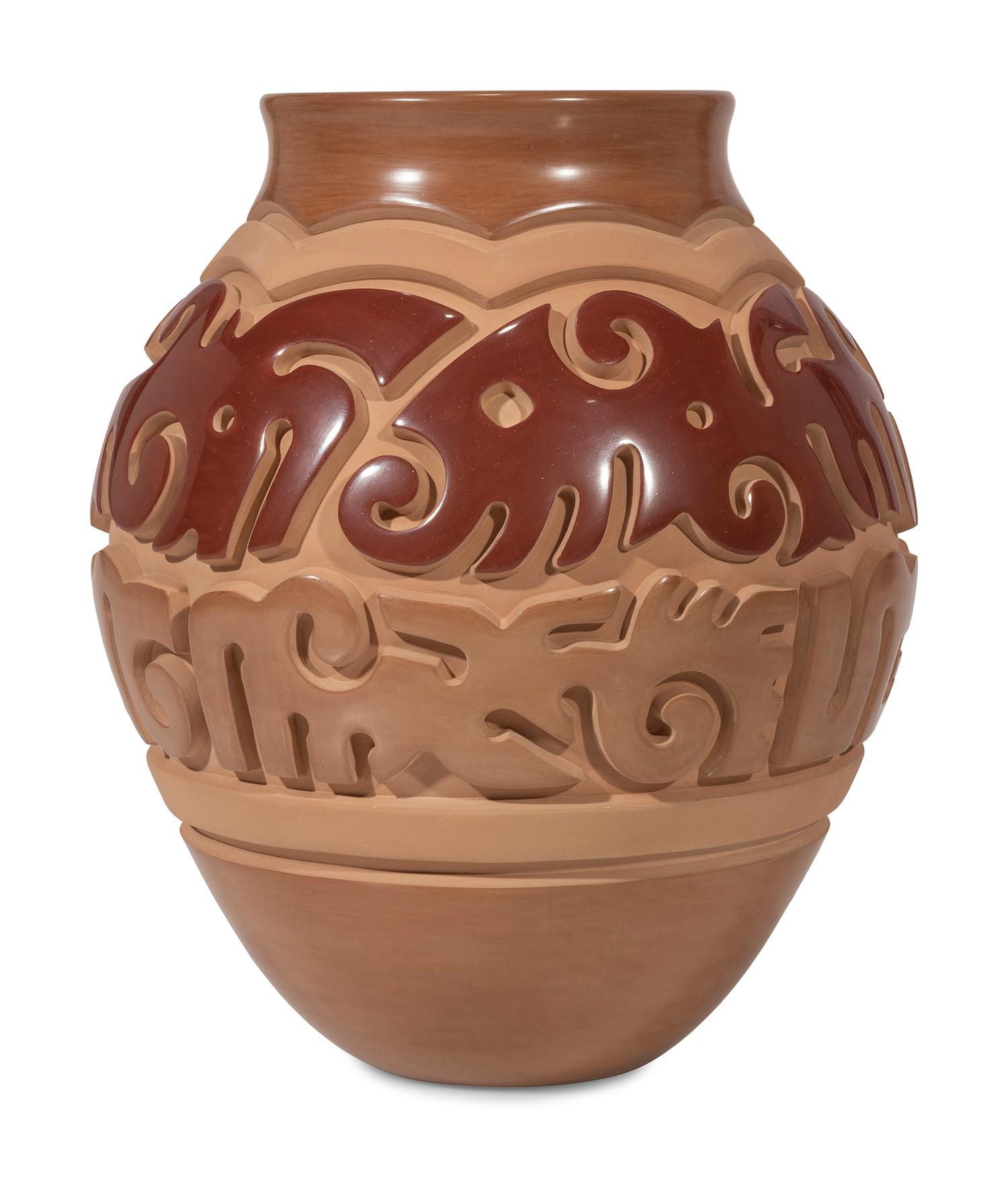 Red and Tan Carved Pottery Jar
