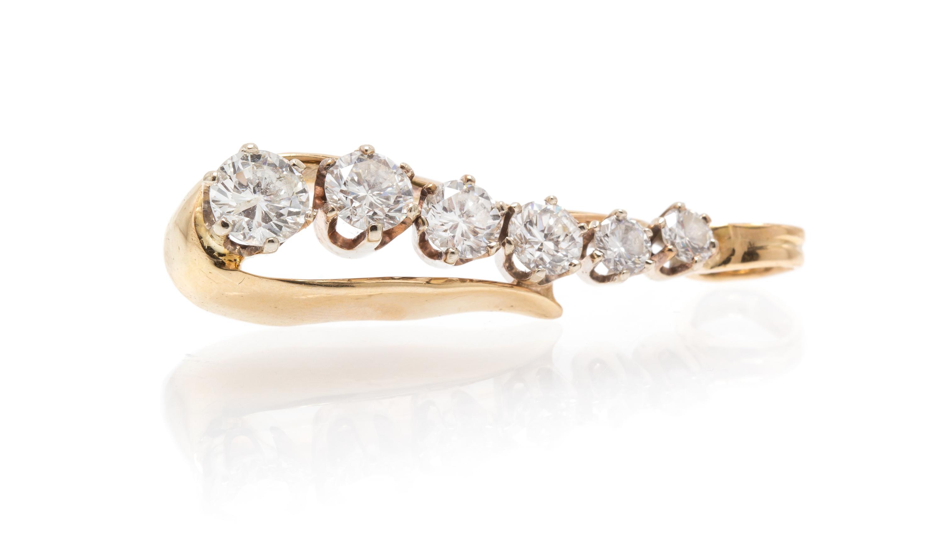 A Yellow Gold and Diamond Journey Pendant, 4.70 dwts.