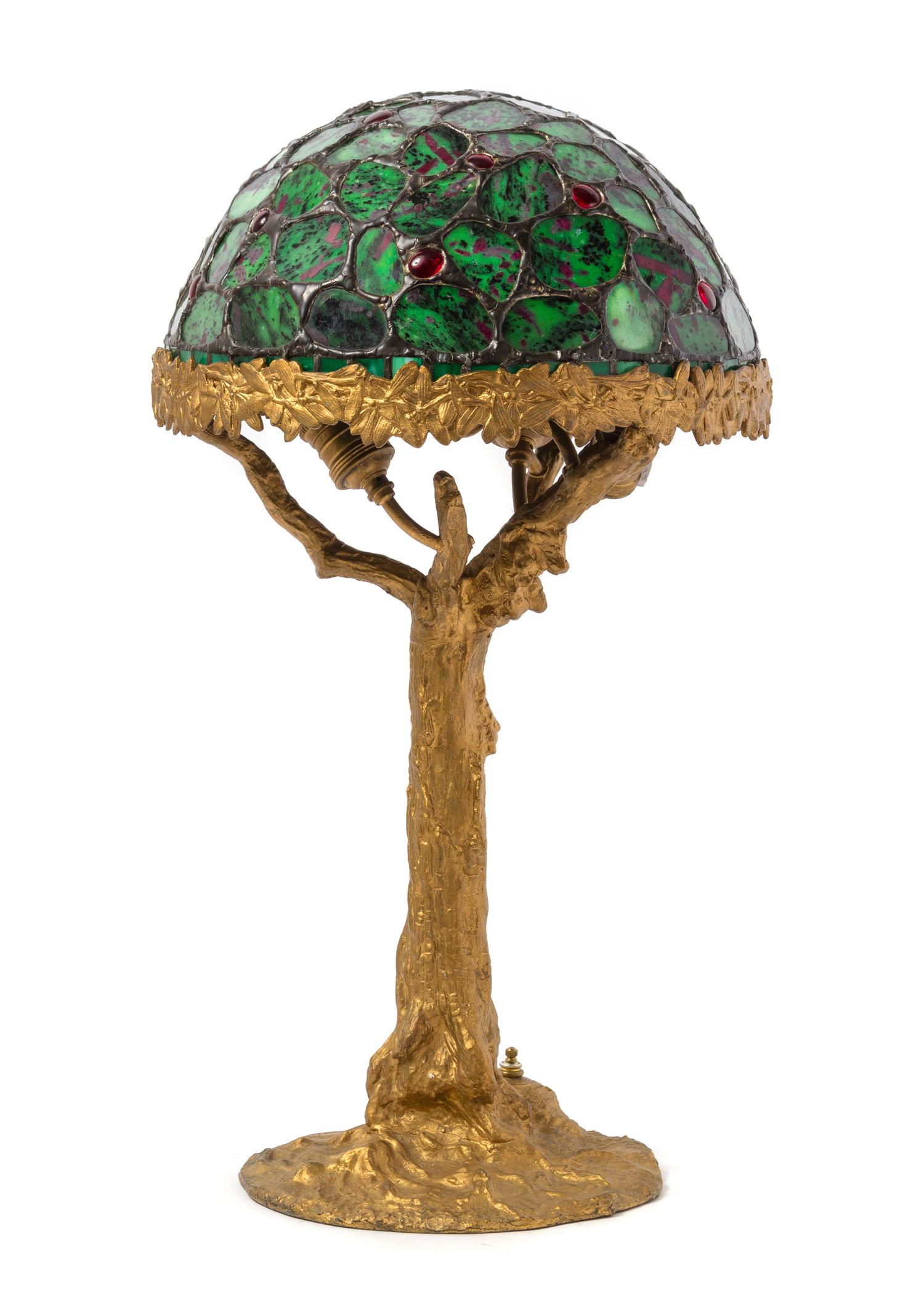 A Leaded Ruby-in-Zoisite Table Lamp Diameter of shade 13 inches, height overall 24 inches. — JULIE RAUSCHENBERGER, LATE 20TH CENTURY