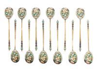 A Set of Twelve Russian Silver and Enamel Spoons, Mark of 20th Artel, Moscow, early 20th century, each having an enameled finial surmou
