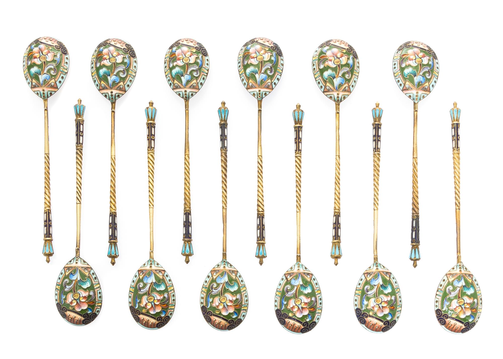 A Set of Twelve Russian Silver and Enamel Spoons, Mark of 20th Artel, Moscow, early 20th century, each having an enameled finial surmou