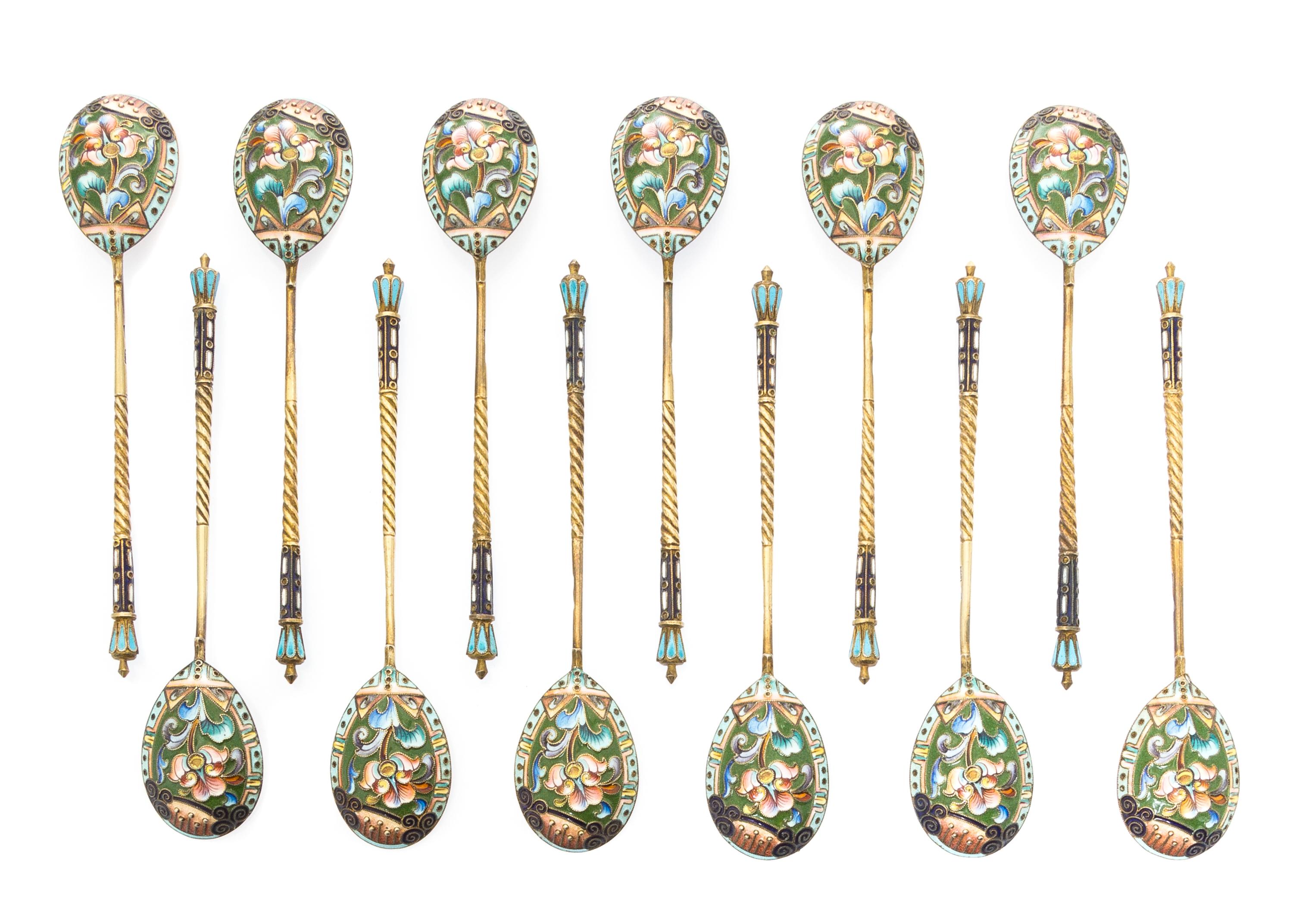 A Set of Twelve Russian Silver and Enamel Spoons, Mark of 20th Artel, Moscow, early 20th century, each having an enameled finial surmou