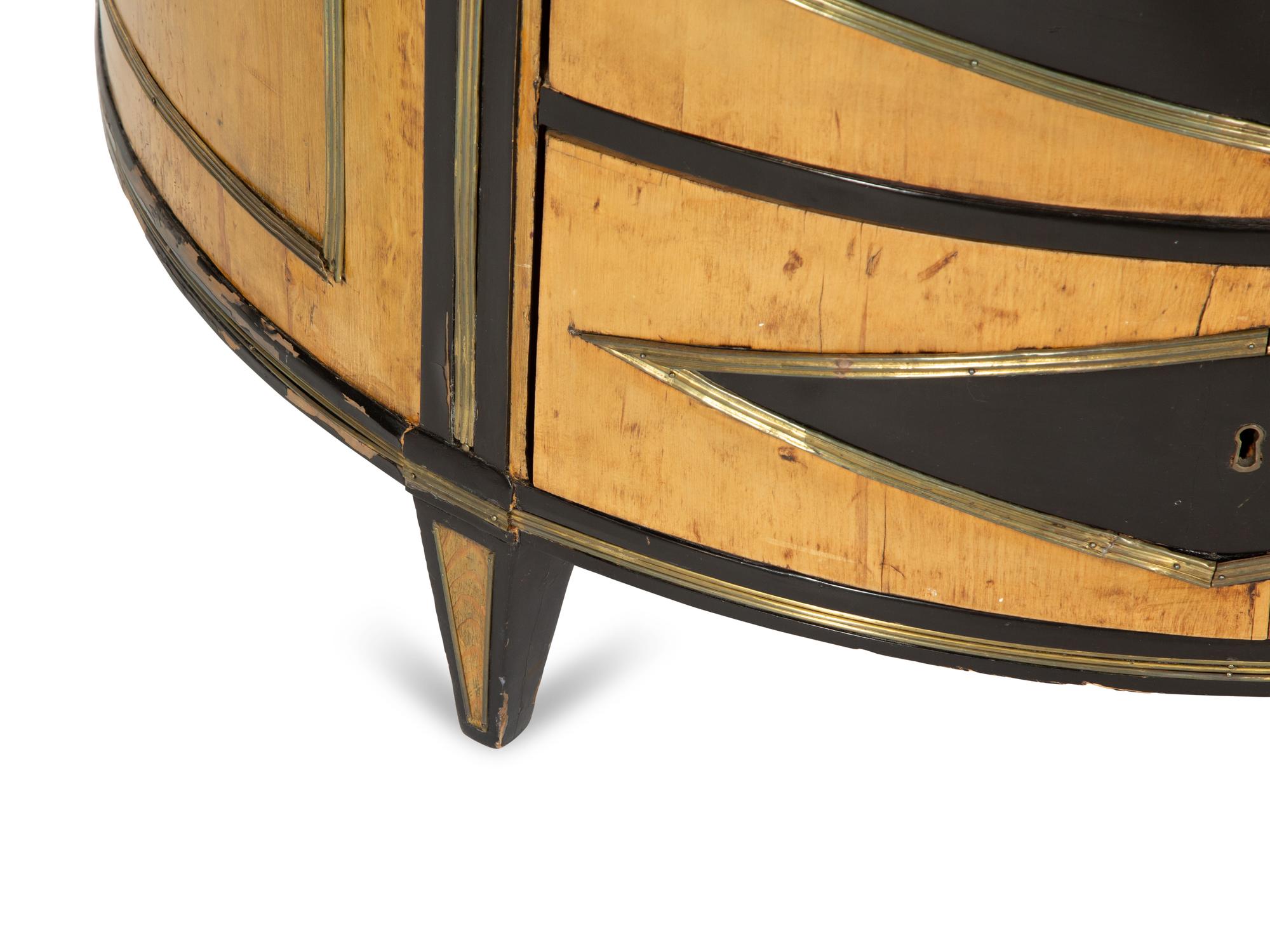 A Russian Neoclassical Part-Ebonized Birch Bowfront Commode