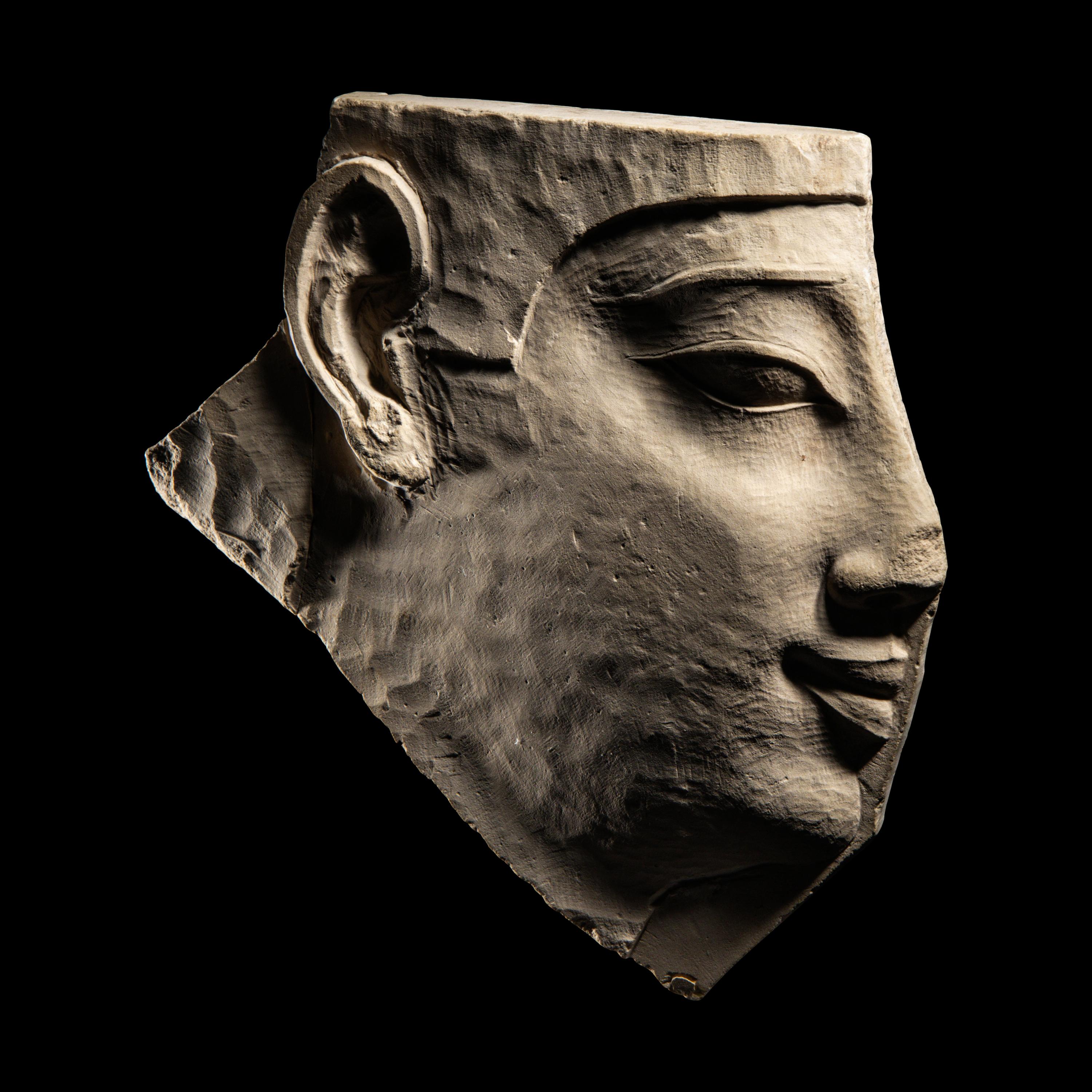 An Egyptian Limestone Sculptor's Model Fragment