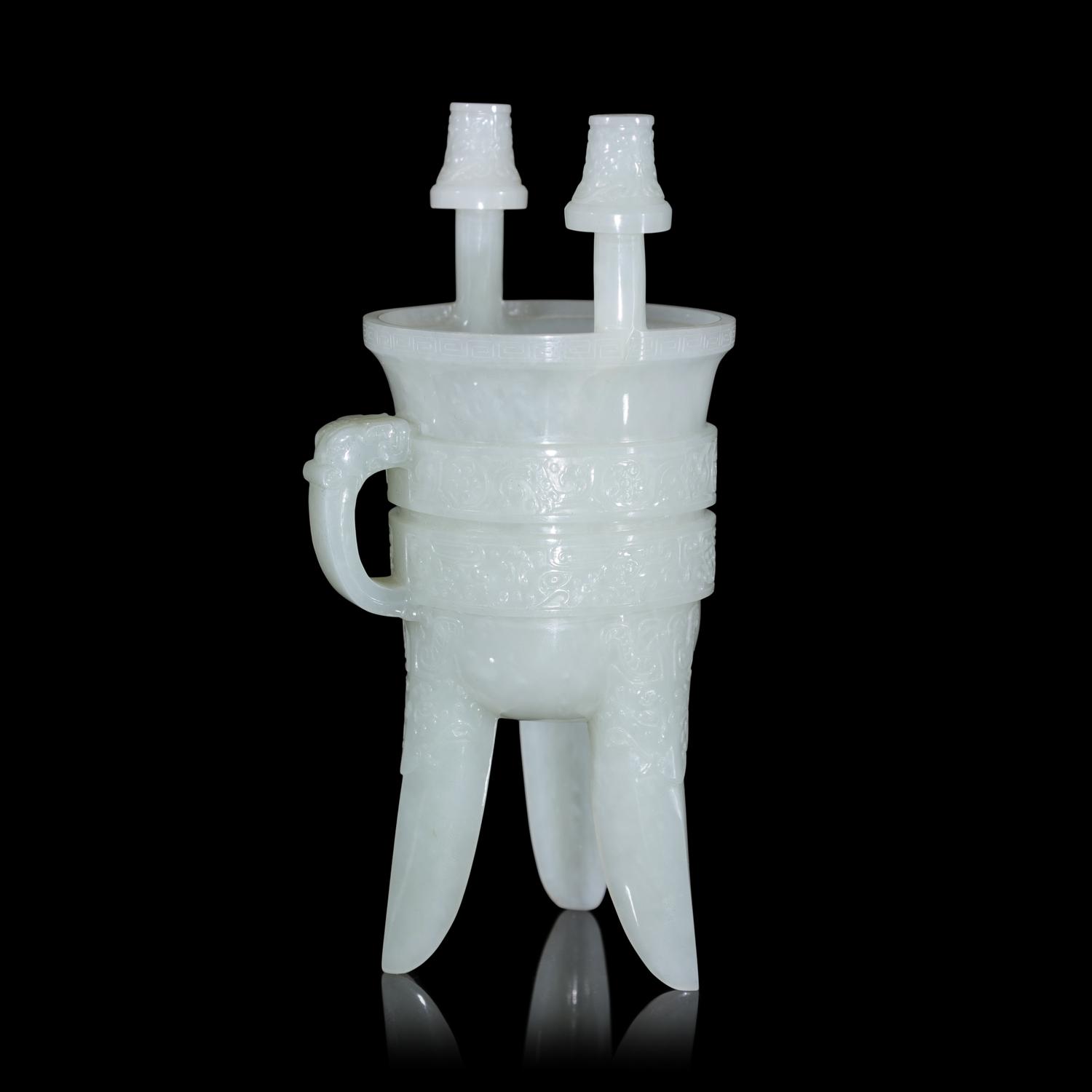 A Chinese Carved Pale Celadon Jade Tripod Vessel, Jia, Late Qing - Early Republic Period 晚清/民國 青白玉仿古斝