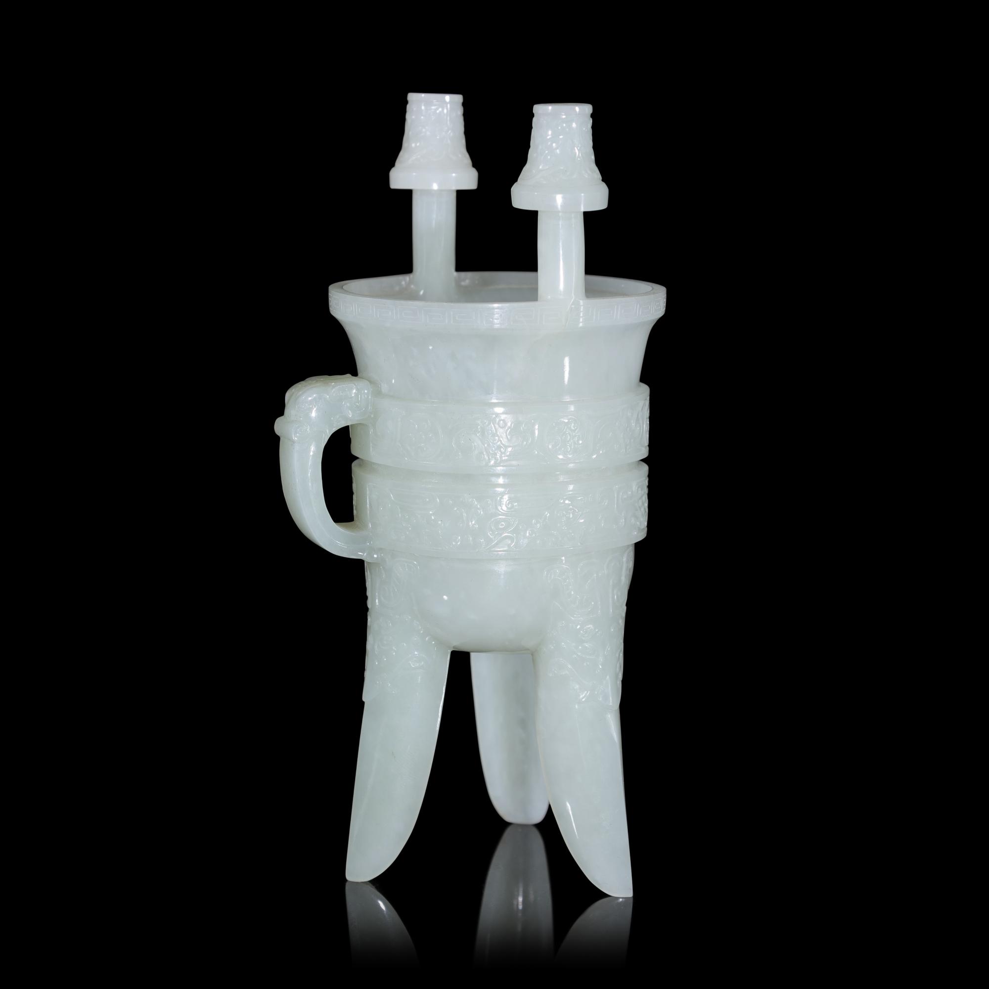 A Chinese Carved Pale Celadon Jade Tripod Vessel, Jia, Late Qing - Early Republic Period 晚清/民國 青白玉仿古斝