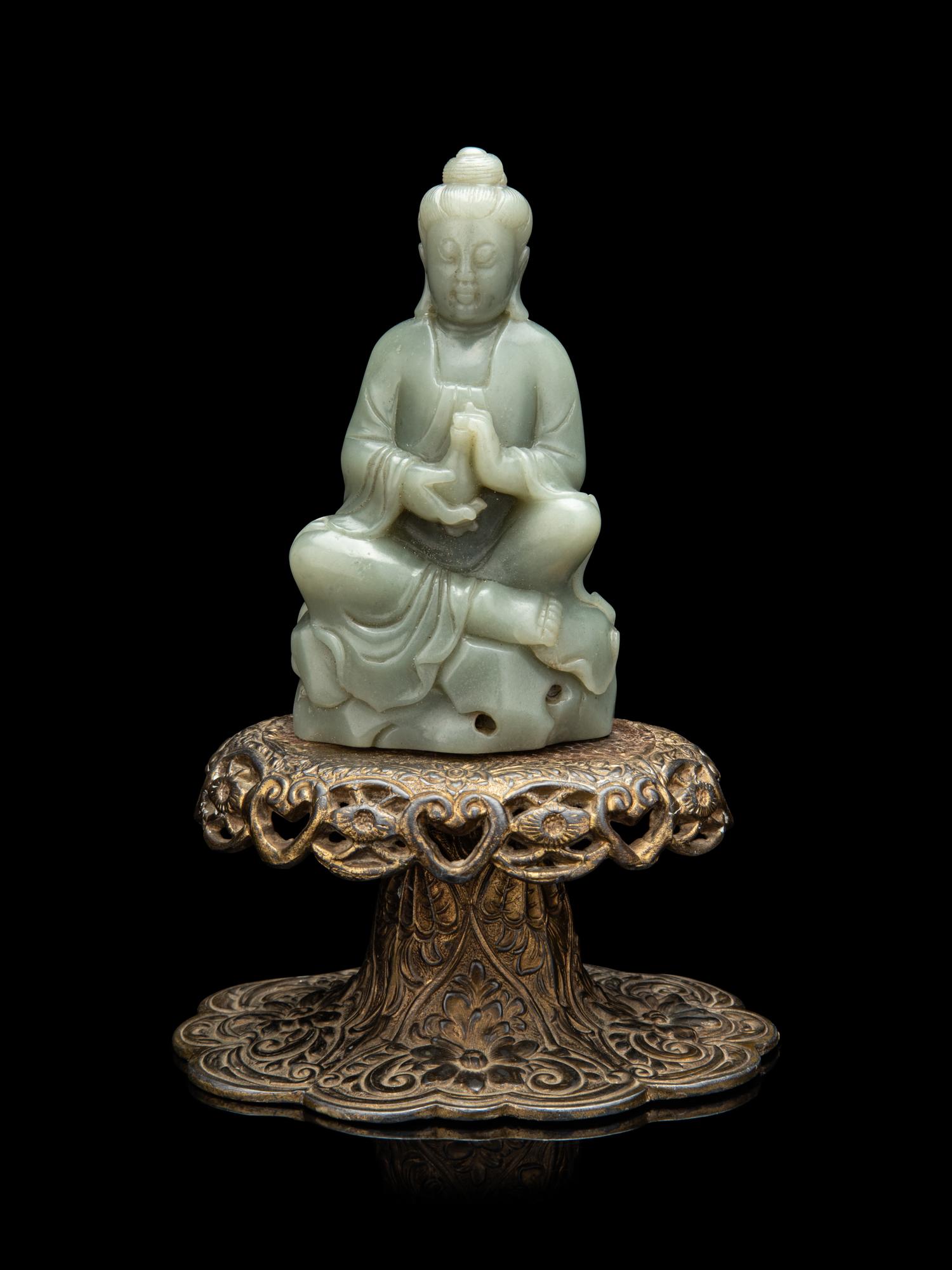 A Chinese Celadon Jade Figure of Seated Guanyin