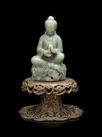 A Chinese Celadon Jade Figure of Seated Guanyin