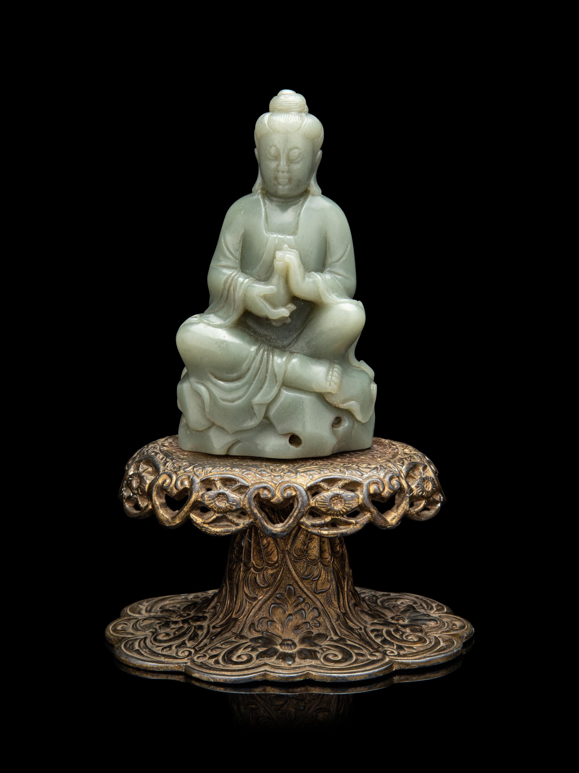 A Chinese Celadon Jade Figure of Seated Guanyin