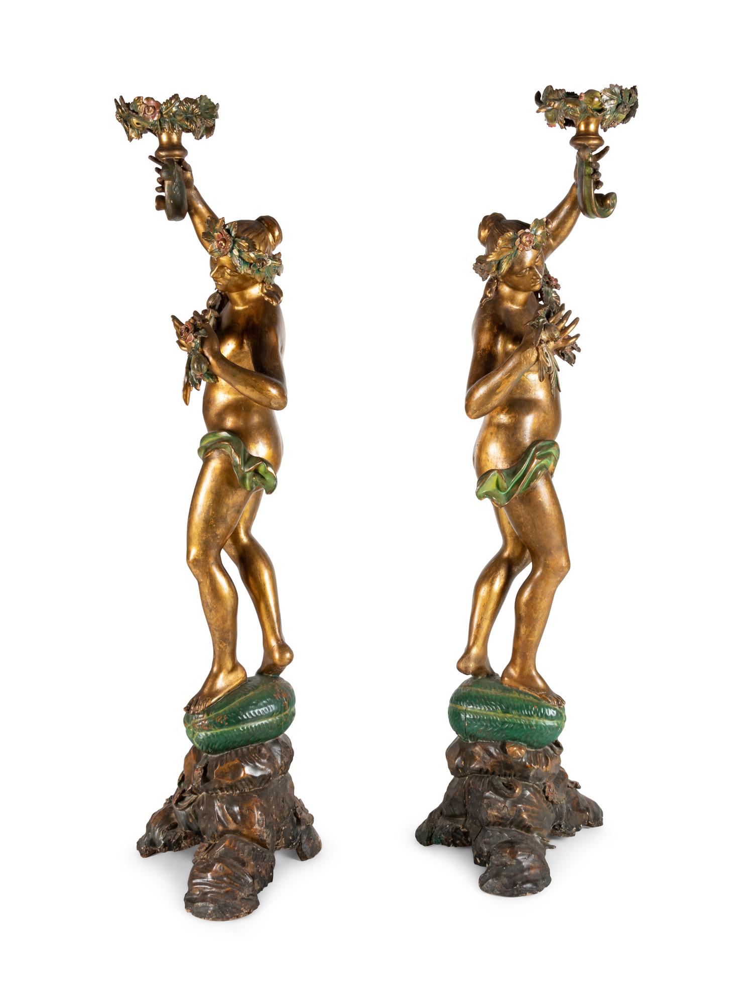 A Pair of Continental Gilt and Polychromed Figural Torchères