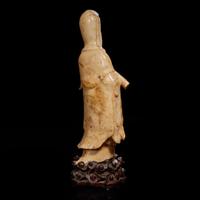 A Chinese carved beige soapstone figure of Guanyin and carved hardwood stand 壽山石雕觀音配木座 Late Qing dynasty/Republic period ?????