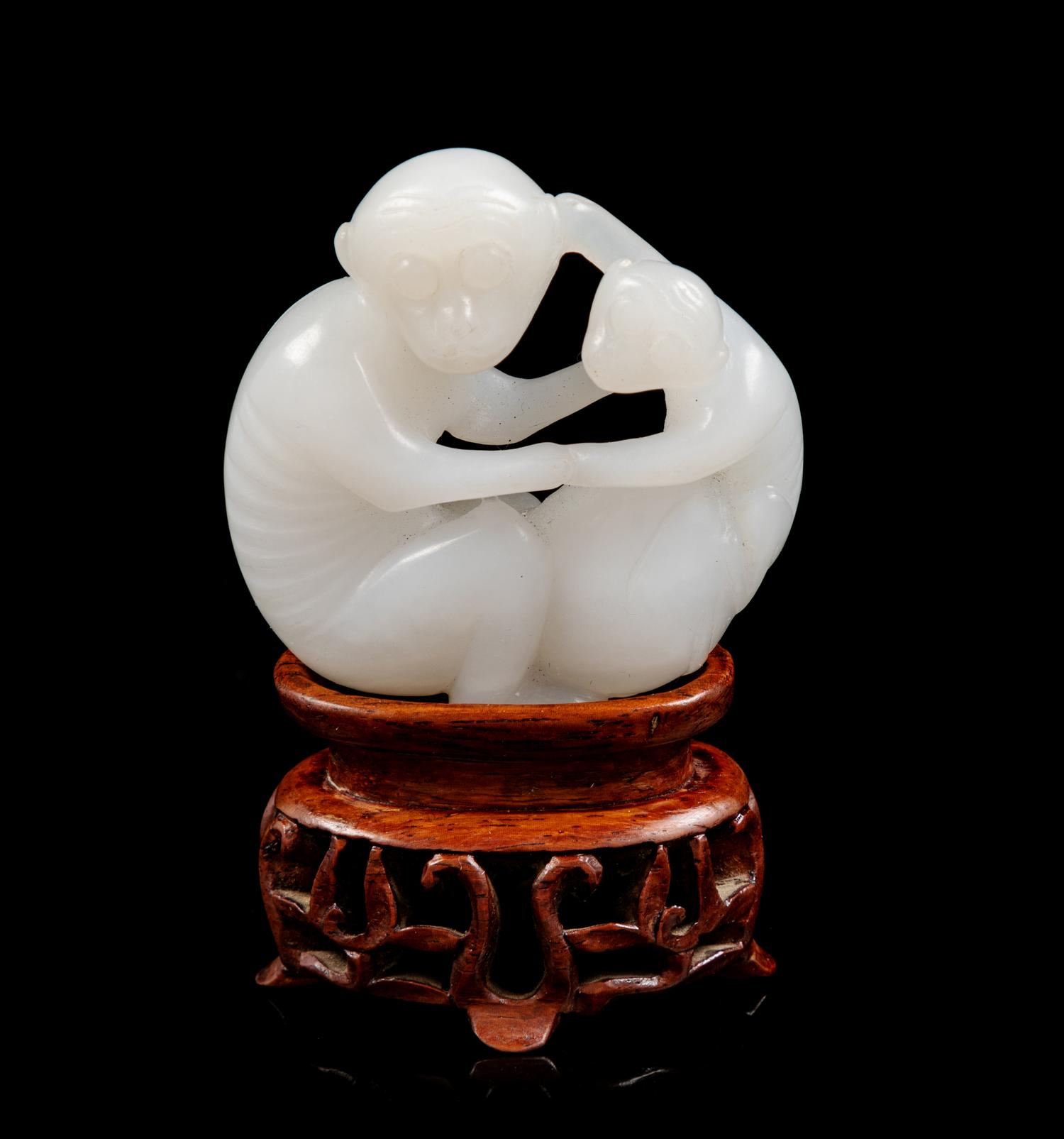 A Chinese White Jade Figural Group of Two Monkeys