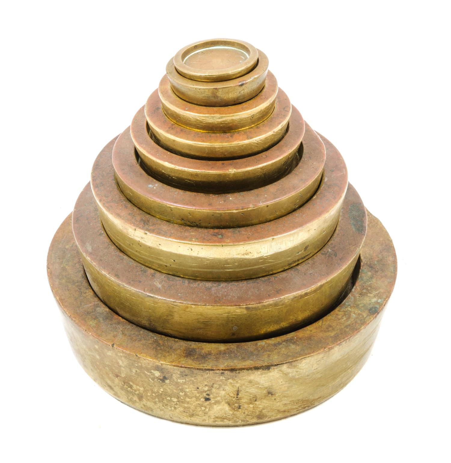 A Set of Nine Brass Sovereign Weights Diameter of largest 6 inches. — WHITEHEAD, MORRIS & CO. LTD AND OTHERS, LONDON, 19TH CENTURY