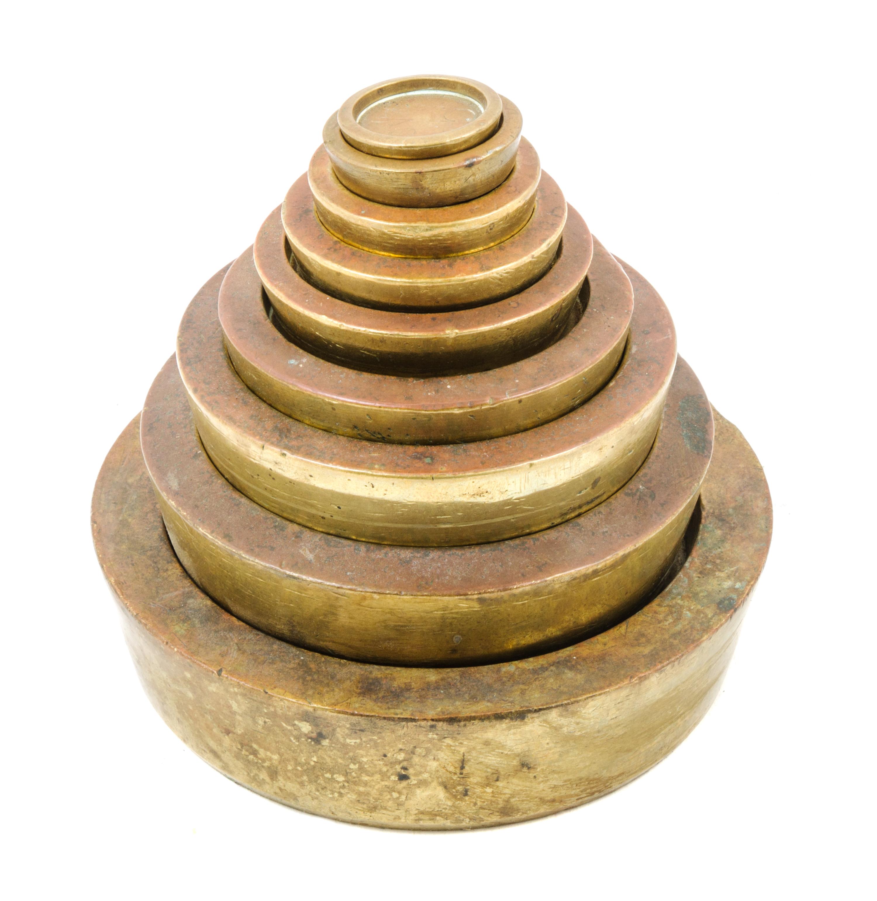 A Set of Nine Brass Sovereign Weights Diameter of largest 6 inches. — WHITEHEAD, MORRIS & CO. LTD AND OTHERS, LONDON, 19TH CENTURY
