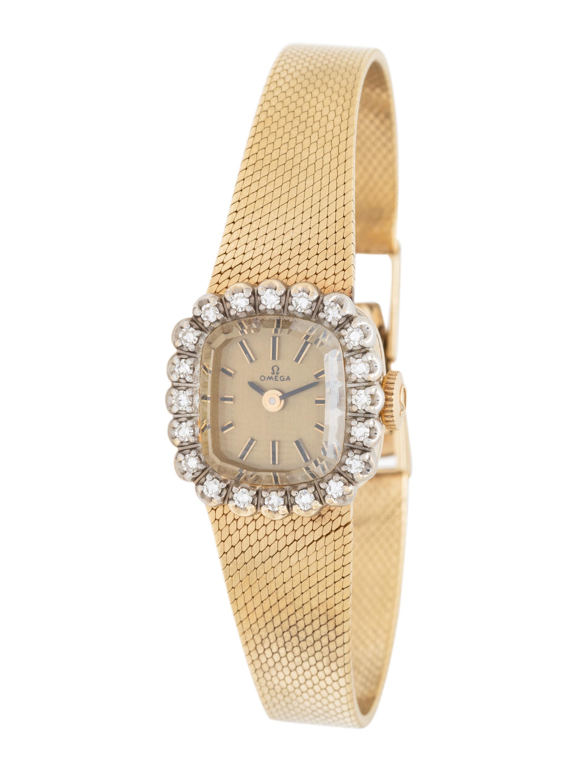 OMEGA, 14 KARAT YELLOW GOLD AND DIAMOND WATCH