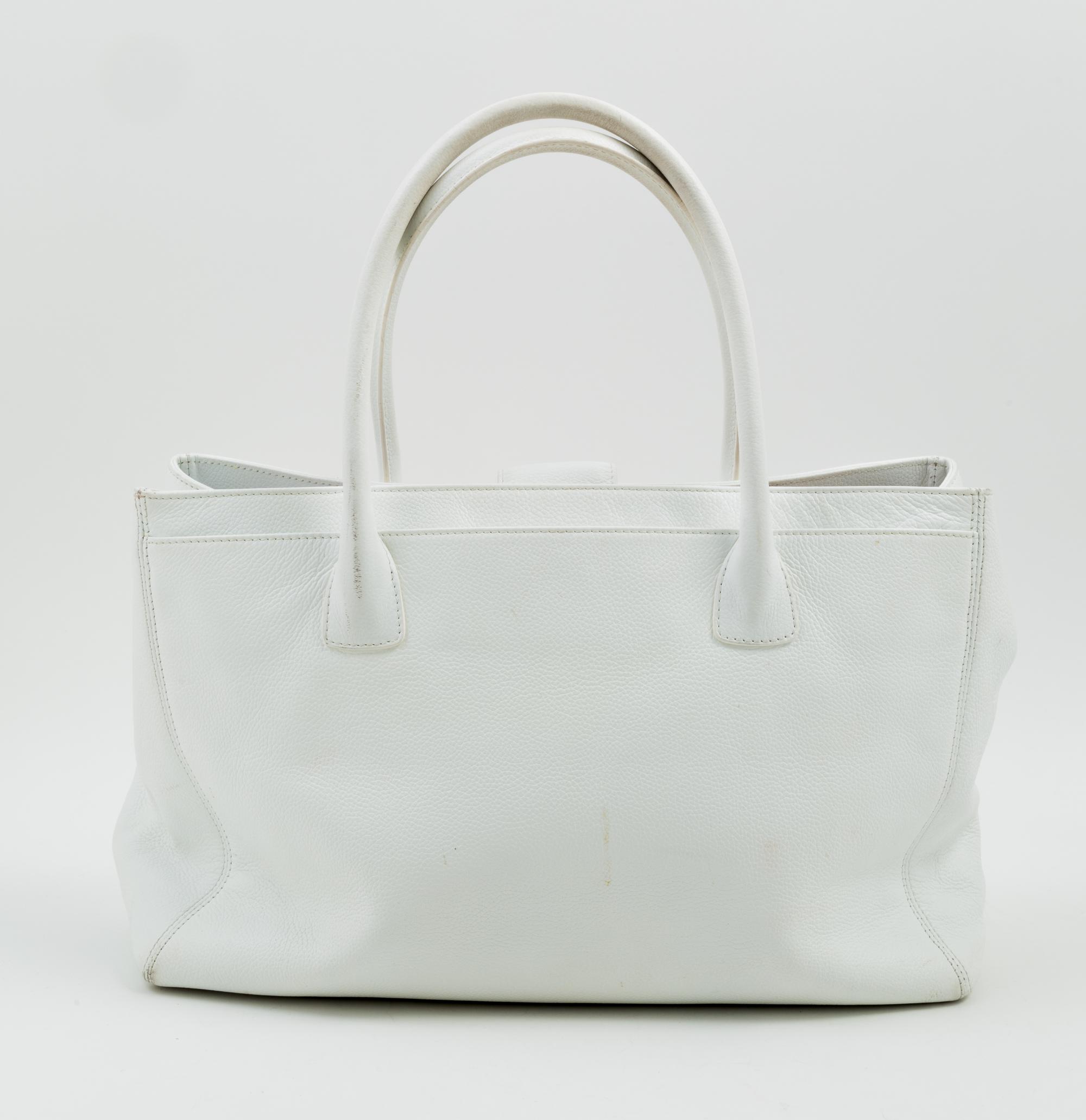 A Chanel White Caviar Tote Bag, 13.3" x 10" x 5.5"; Handle drop: 6.5".