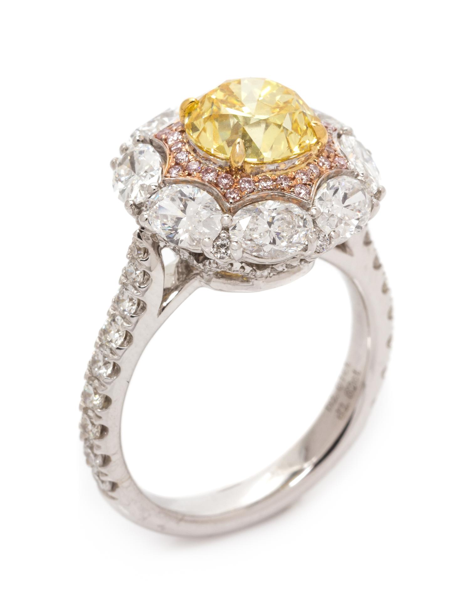 An 18 Karat Tricolor Gold, Fancy Vivid Yellow Diamond, Diamond and Colored Diamond Ring, 4.90 dwts.