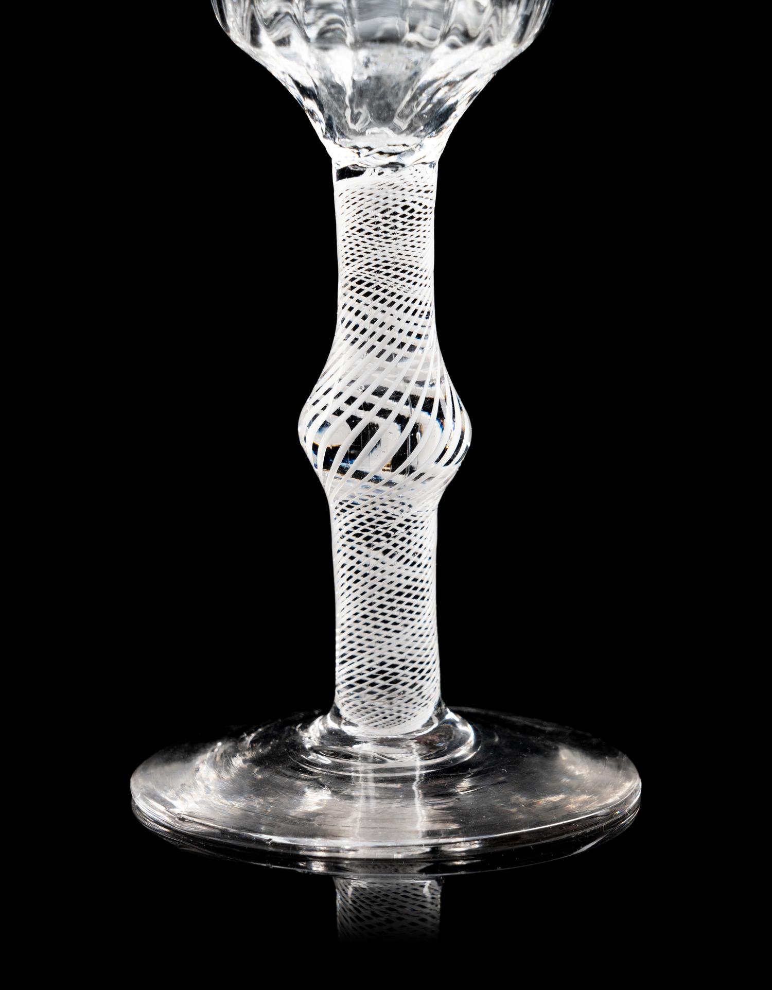 Two Moulded Glass Wine Glasses
