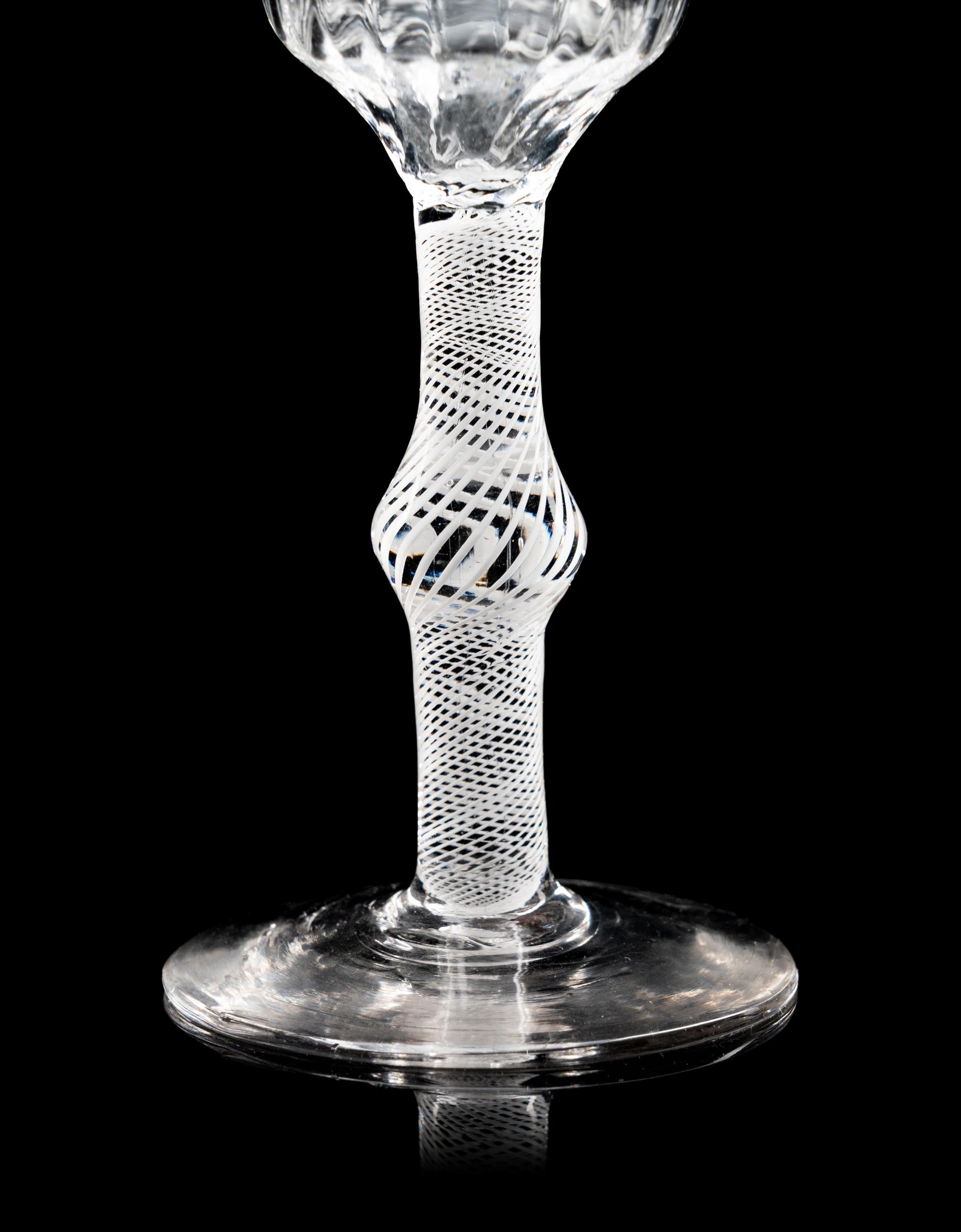 Two Moulded Glass Wine Glasses