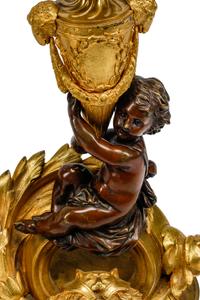A Pair of Louis XV Style Gilt and Patinated Bronze Figural Chenets