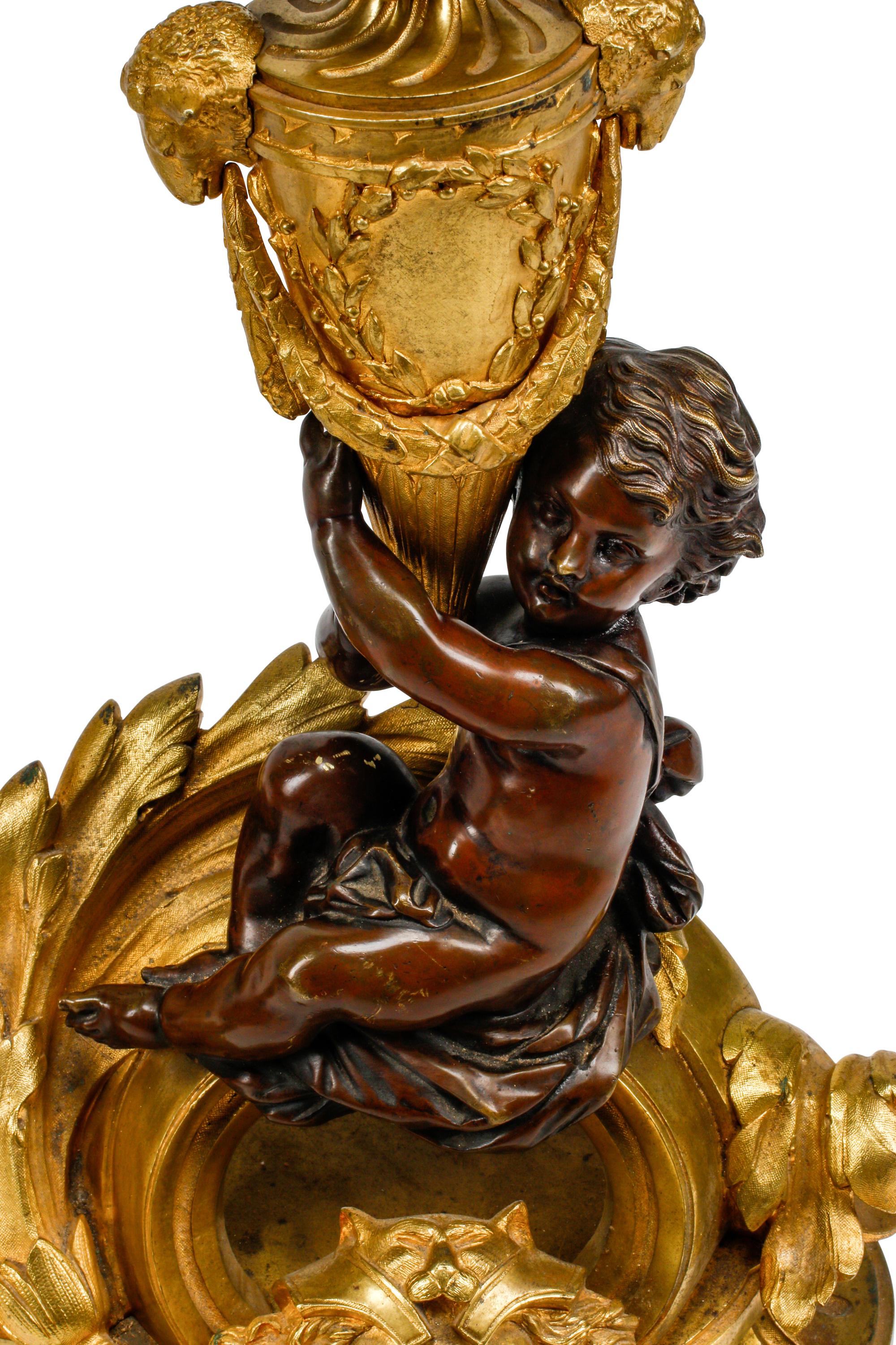A Pair of Louis XV Style Gilt and Patinated Bronze Figural Chenets