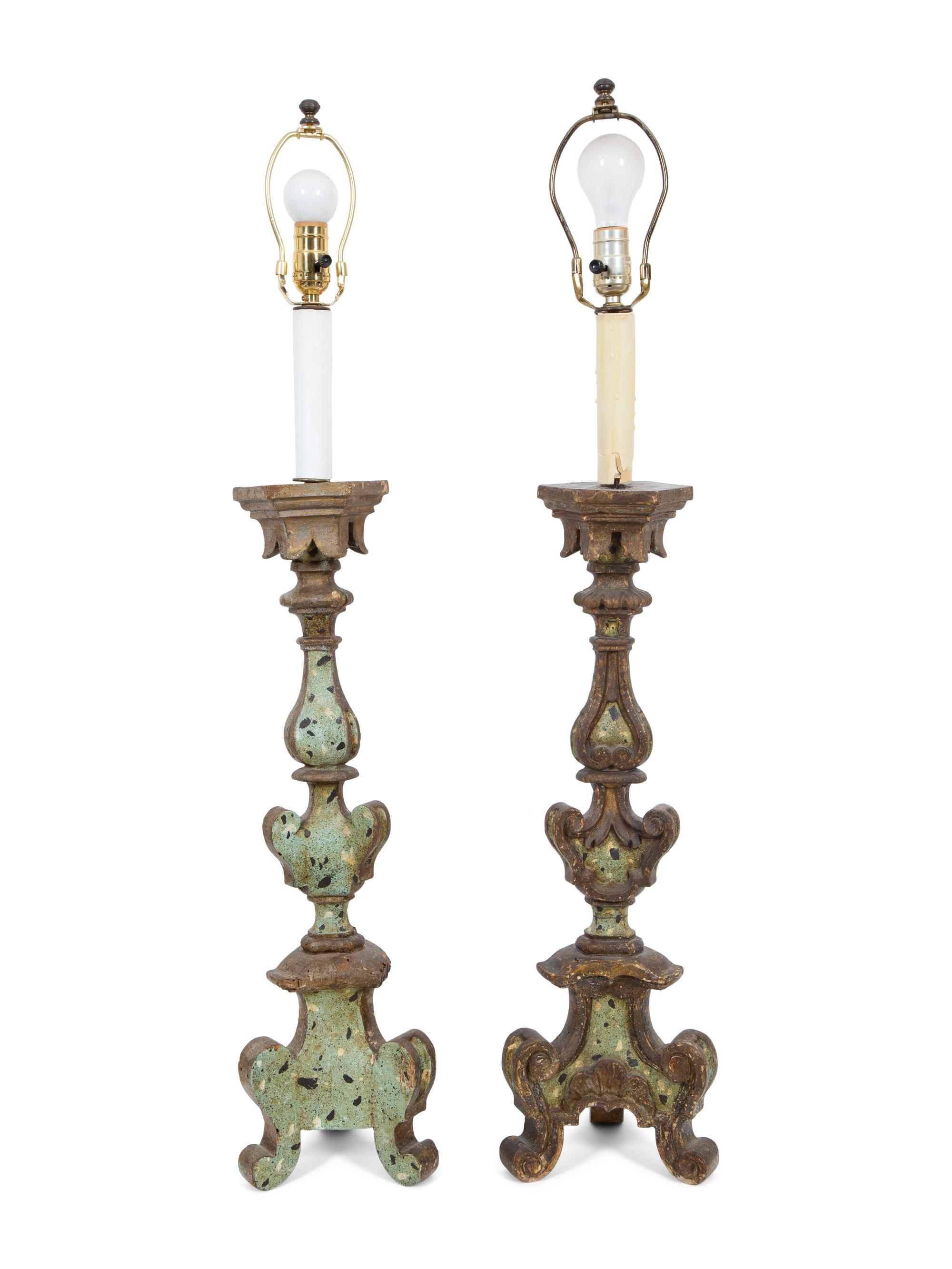 A Pair of Italian Painted and Parcel Gilt Pricket Candlesticks
