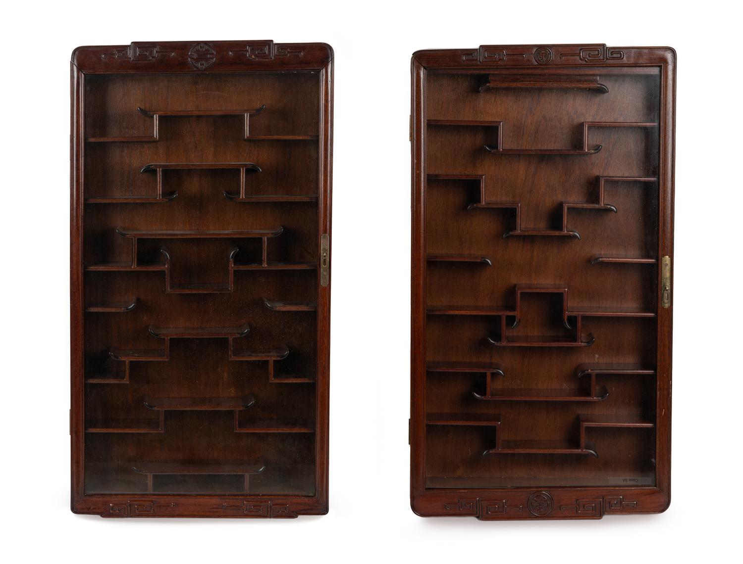 A Pair of Chinese Carved Hardwood Vitrine Cabinets