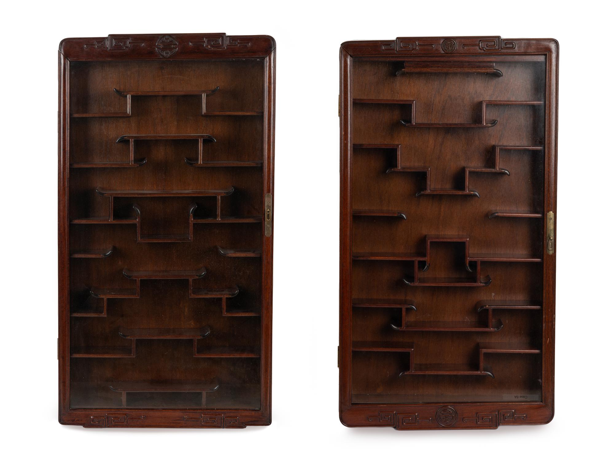 A Pair of Chinese Carved Hardwood Vitrine Cabinets